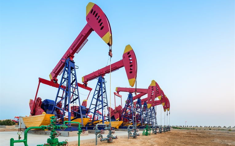 Oilfield pump jacks at a well site